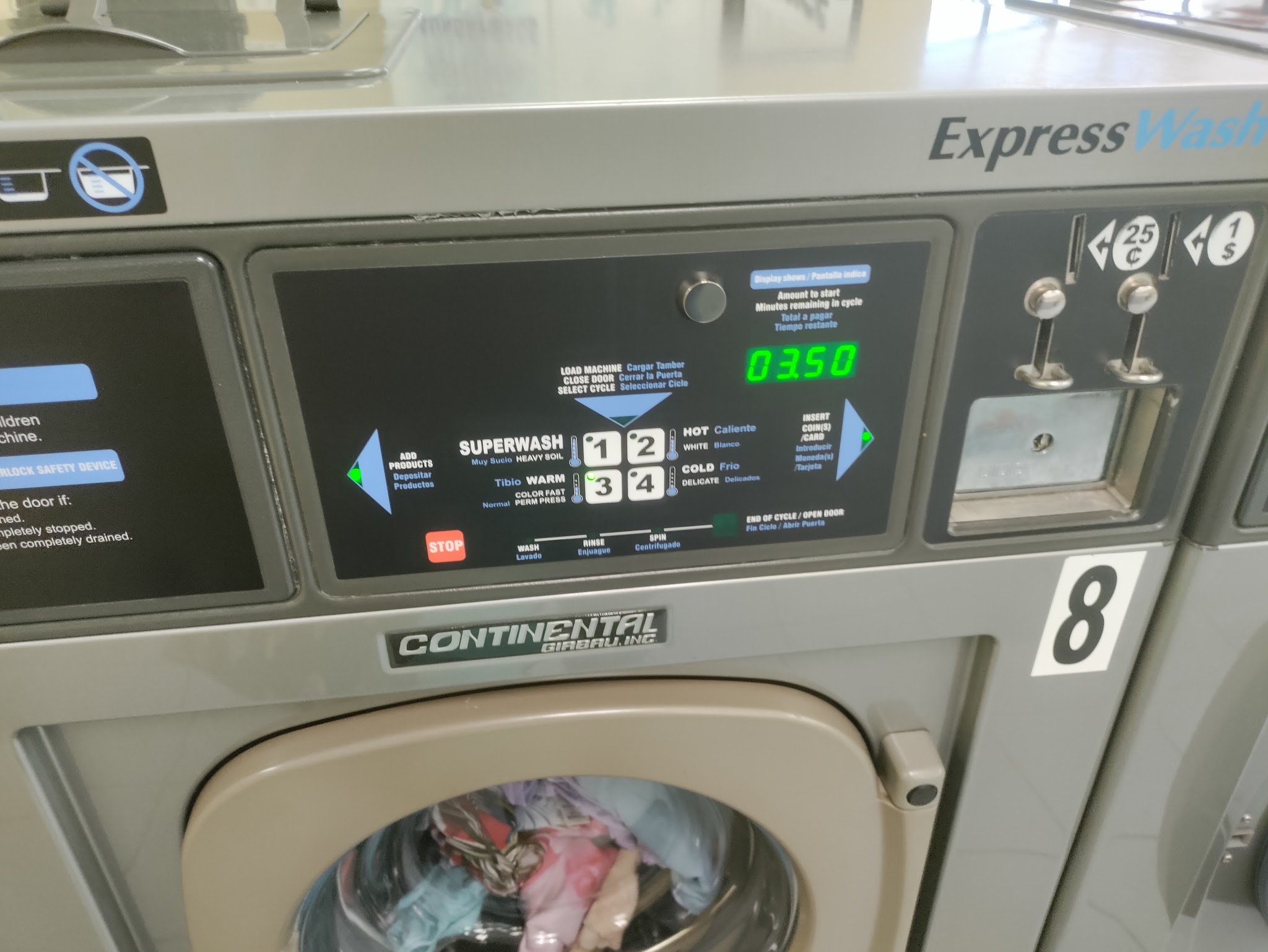 Close-up of a Continental ExpressWash machine showing the digital display and coin slot