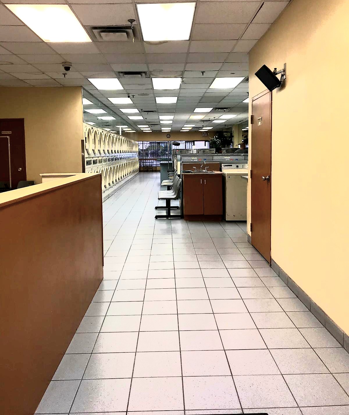 View from the entrance showing the front counter and machine rows