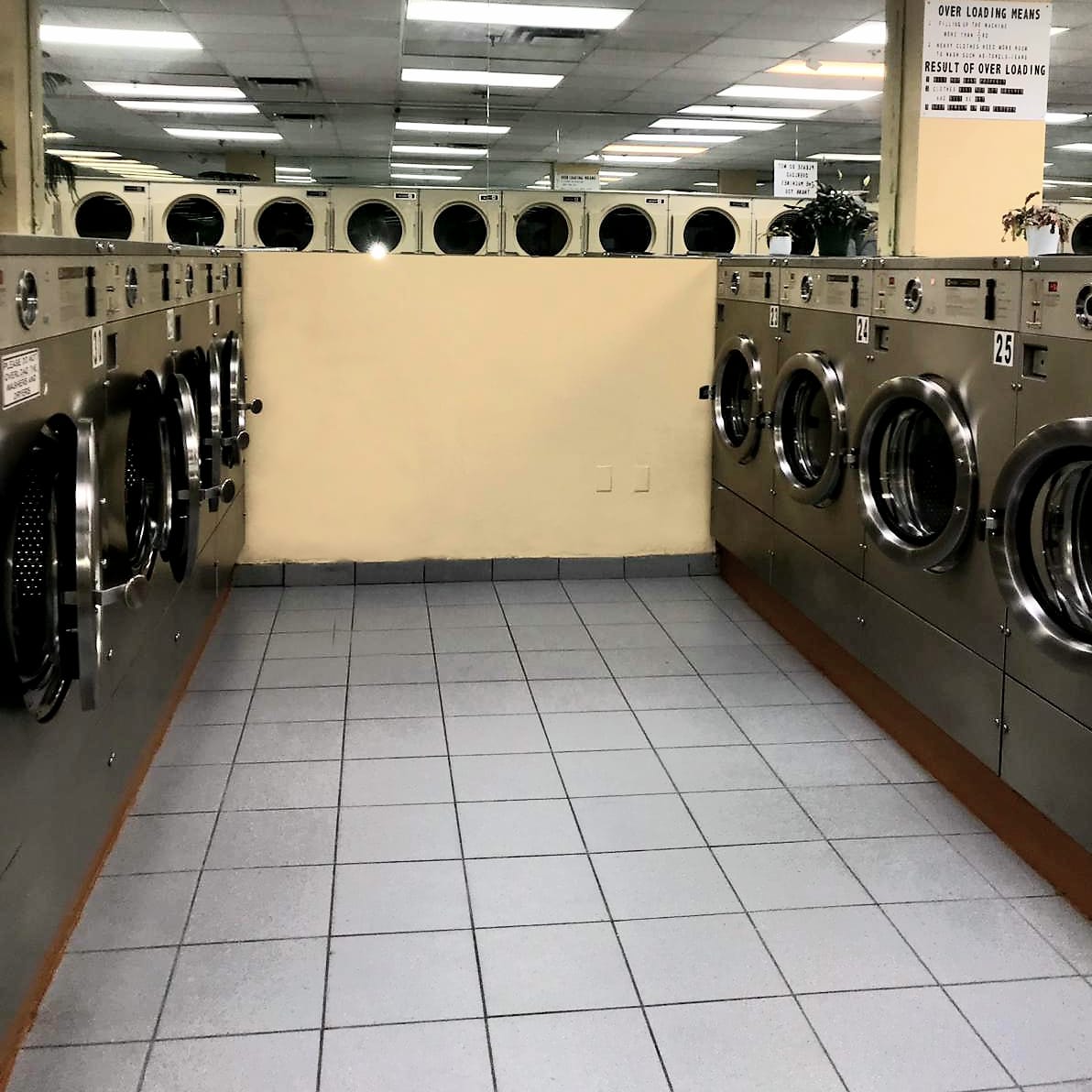 Corner section showing front-load washers and top-load dryers
