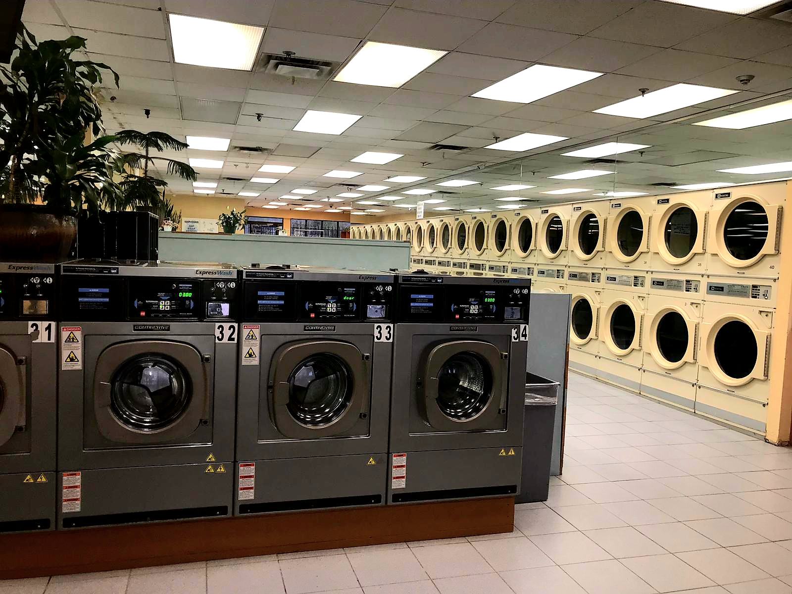 Commercial stacked dryers and front-load washers at York U Coin Laundry